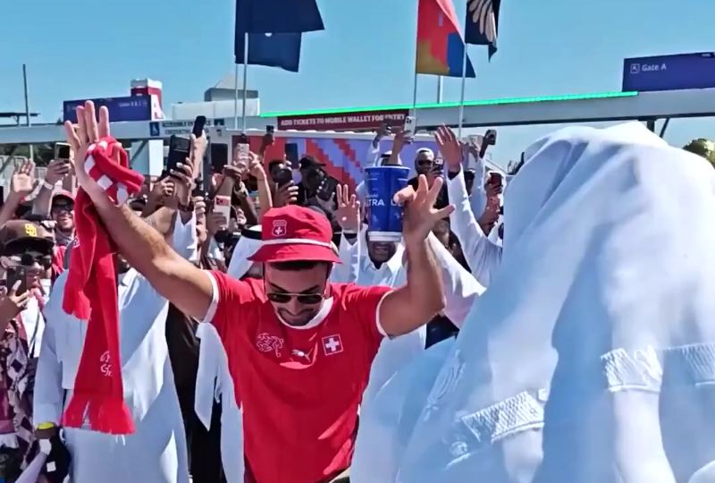 Qatar and Switzerland fans dance together before World Cup clash